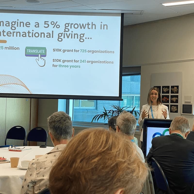 People in a meeting discussing global giving